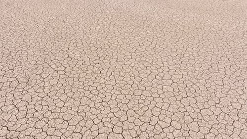 Aerial of the cracked surface of a dry lake