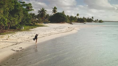 Young Woman Walking on a White Sand Beach in Tropical Paradise Maupiti Island French Polynesia