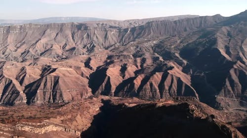 Aerial View of Rugged Desert Mountains and Canyons