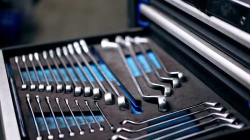 Closeup Top Shot at a Service Station Hand Opens Puts Tools and Closes a Drawer