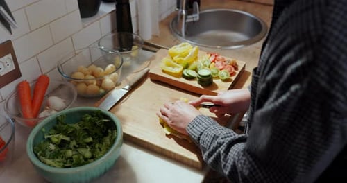 Preparing Fresh Vegetables for Salad in Home Kitchen
