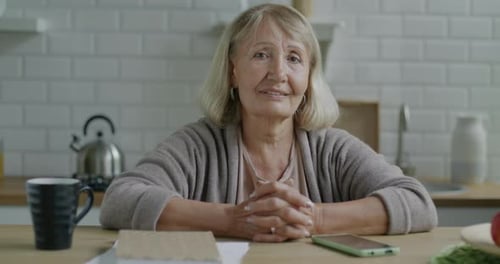 Senior Woman Smiling in Kitchen Portrait