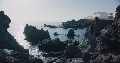Rocky volcanic shore and beach in the small fishing village of Alcala. Tenerife. Canary Islands. Spa