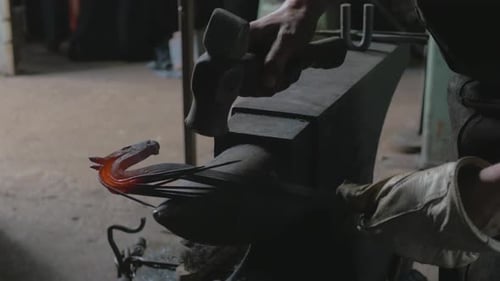 Blacksmith Forging Metal Horse Sculpture on Anvil