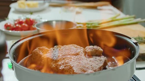 Flambeing Beef Steak in a Grill Pan