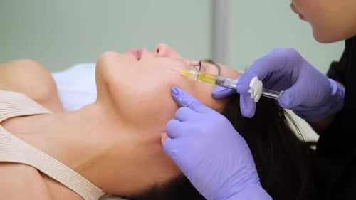 Cosmetic Injection Treatment for Woman's Face in Clinic