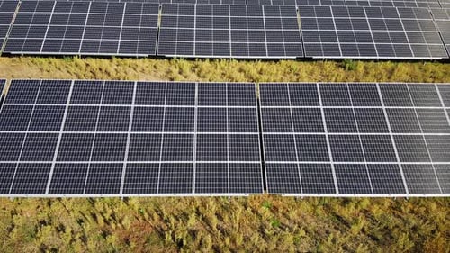 Aerial View of Solar Panels in Field