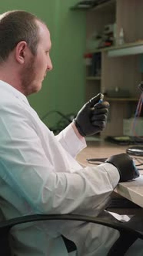Scientist Working in Lab With Equipment