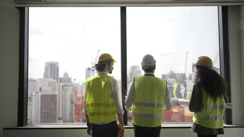 Engineers work in high rise building.