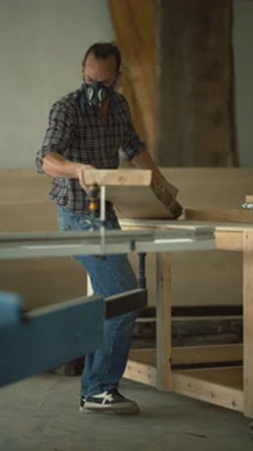 Woodworker Preparing Wooden Plank for Cutting