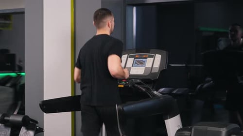 Male Athletic Youthful Male Running Treadmill