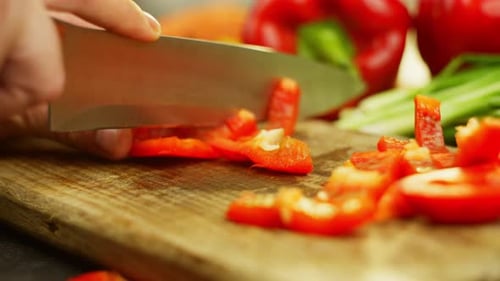 Close Up of Cutting a Fresh Red Pepper