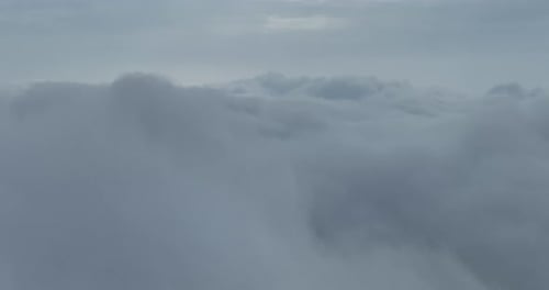 Scenic Aerial View of Puffy Gray-White Clouds