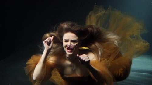 Woman Drowns in the Ocean and Calls for Help A Girl in a Dress Under Water
