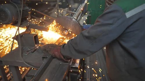 Industrial Worker Cutting Metal with a Circular Saw