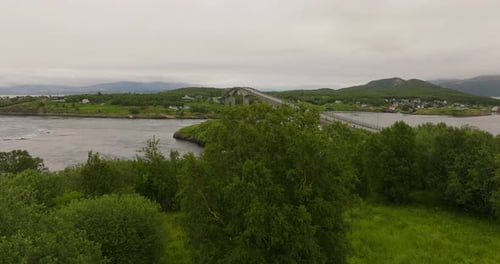 Aerial reveal of Saltstraumen Bridge, the water underneath and surroundings