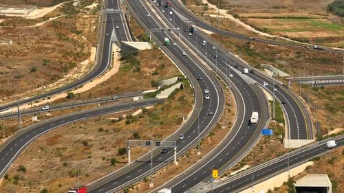 Highway traffic on multiple highways roads with traffic on all roads, Aerial footage