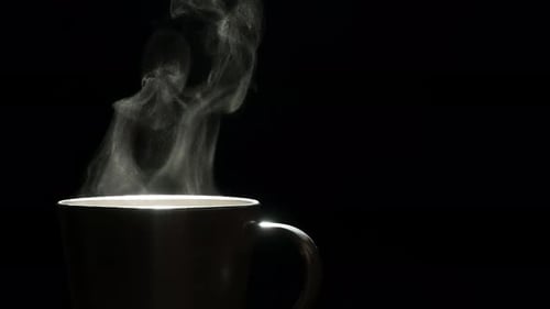 Steaming Hot Beverage Against Black Background
