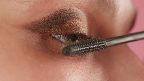 Woman Applies Mascara in Extreme Close-up Shot
