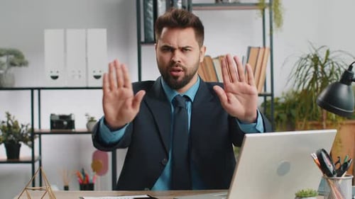 Businessman Working on Laptop Showing Stop Gesture Danger Rejection Warning Crisis Prohibition