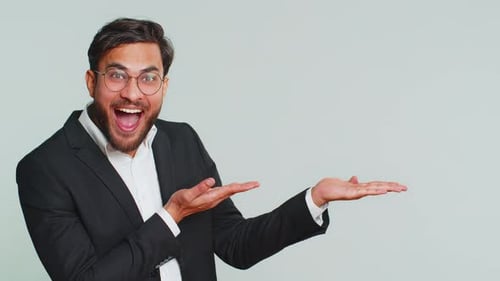 Businessman Showing Thumbs Up and Pointing at Right on Blank Space Place for your Advertisement Logo