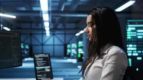 Computer Scientist in Data Center Monitoring Security Threats Using Computer