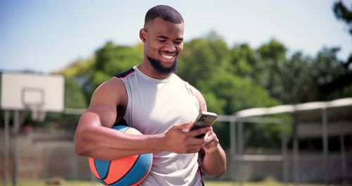 Athlete, cellphone and basketball on court with happiness, technology and text message
