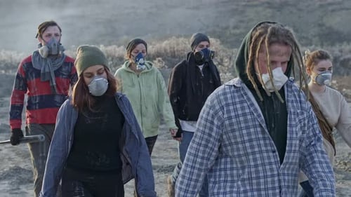 People in Masks Walking in Dystopian Landscape