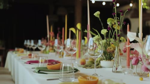 Elegant Wedding Table Setting with Flowers and Candles