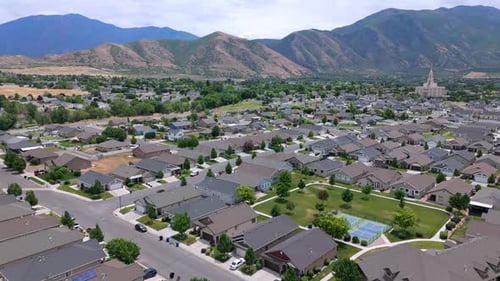 A Stunning Aerial View Showcases a Scenic Suburban Neighborhood Nestled Amidst Majestic Mountains