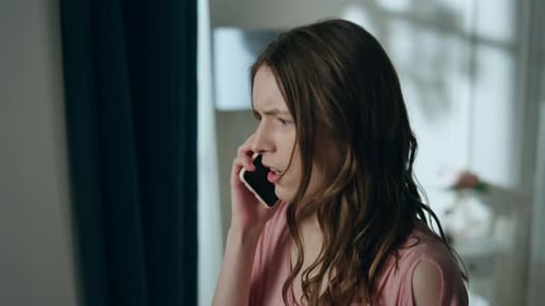 Young Woman Upset on Her Phone