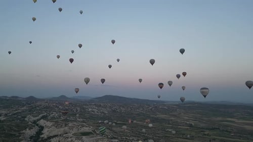 Aerial video over monoliths in Cappadocia, on hot air balloons, Turkey