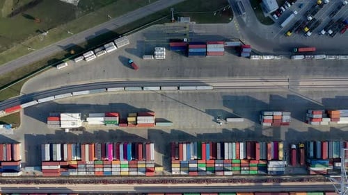Cargo trains leaving the terminal with containers. Drone view.