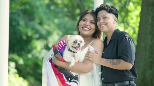 Happy Couple with Dog Smile in the Park