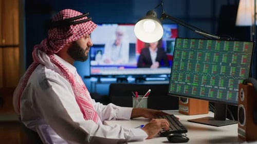 Man Working at Computer at Night