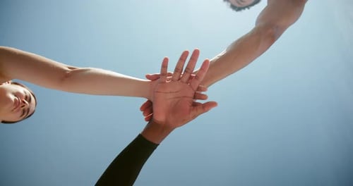 People, stack hands and fitness in low angle with smile, support and connection in summer