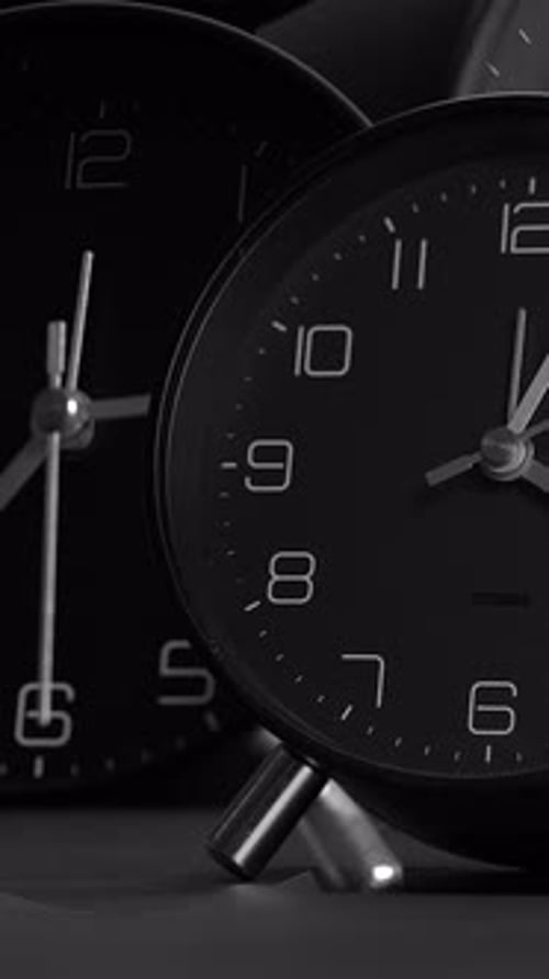 Elegant Black and White Clocks Aesthetically Displaying the Time in a Harmonious Manner