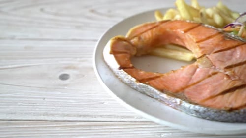 Grilled Salmon with Salad and French Fries