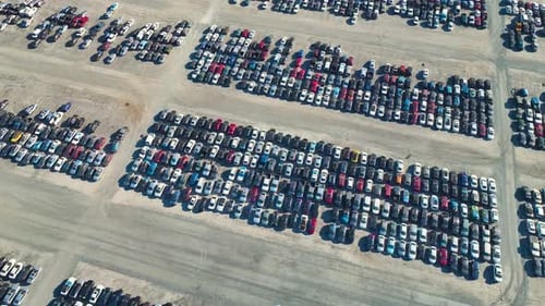 View From Above of Big Parking Lot with Parked Used Cars After Accident Ready for Sale