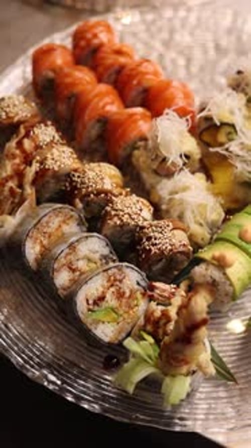 a set of sushi on a silver background, overhead view