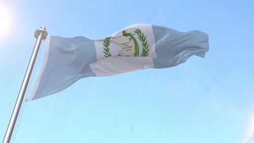 Guatemala National Flag Waving Under Bright Sky