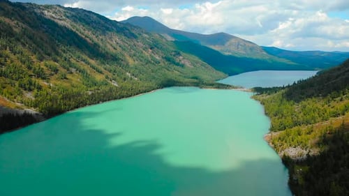 Aerial View Flying Over Turquoise Mountain Lake Media