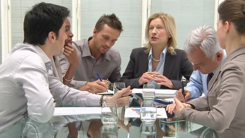 Business teamwork in modern office conference room discussing new financial budget