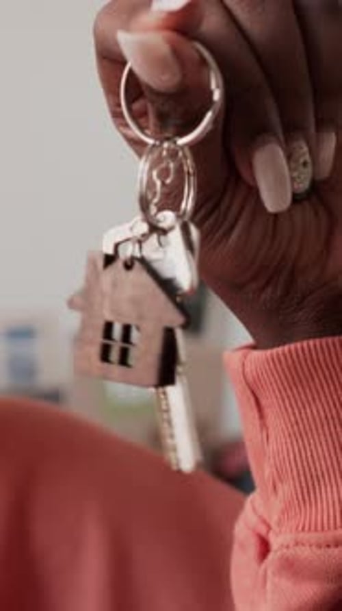 Hand of Female Homeowner Holding Keys