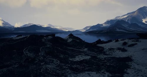 Breathtaking View of Mountains Reflecting in Calm Water at Twilight Hours