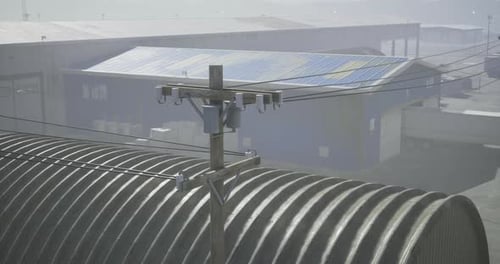 Aerial View of Industrial Area with Power Lines and Warehouses