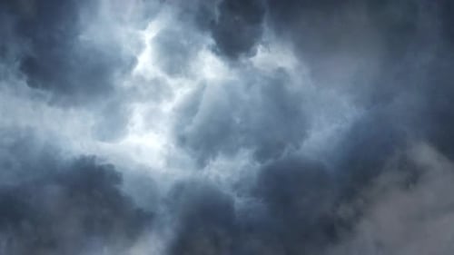 a thunderstorm with a flash that resided in the dark clouds
