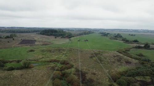 Power Line Industrial View Line of Electric Transmissions in Field Steel Towers with Wires and