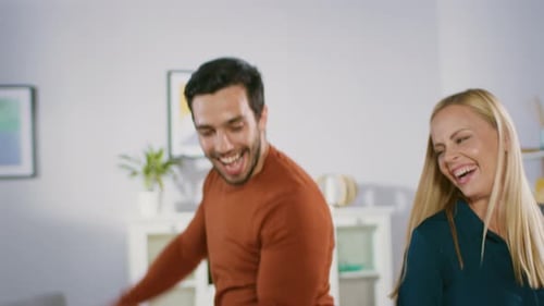 Happy Couple Dancing Together in their Home