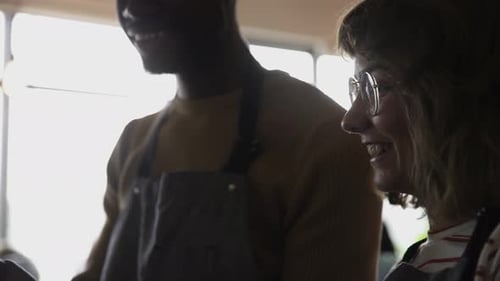 Cafe Workers Using Smartphones Together
